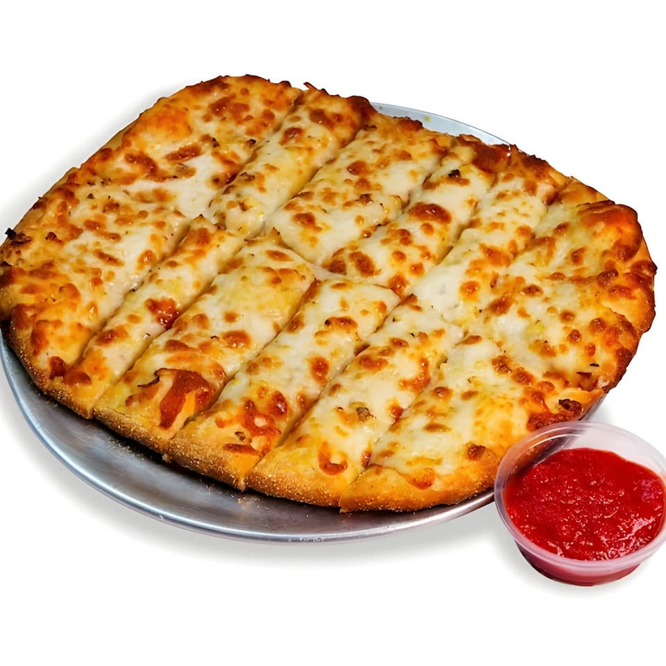 Cheesy breadsticks from Pizza Bites, cut into strips on a metal tray, with a side of marinara sauce.
